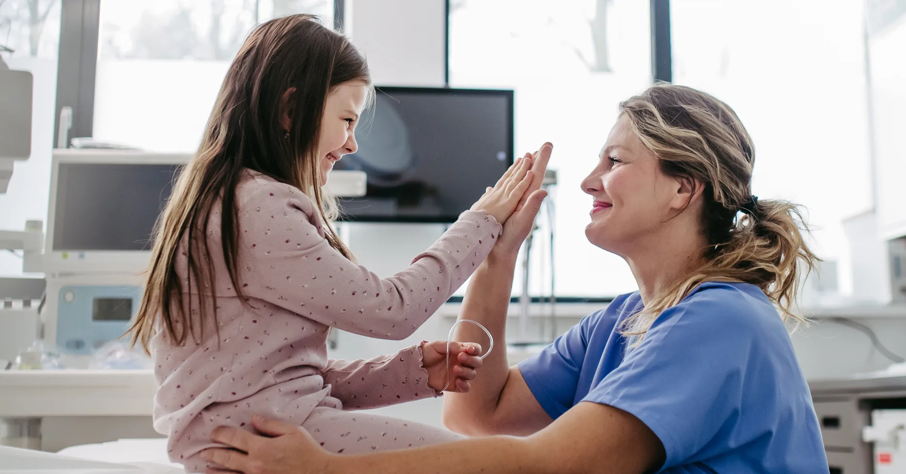 Female doctor talking with her patient in her office