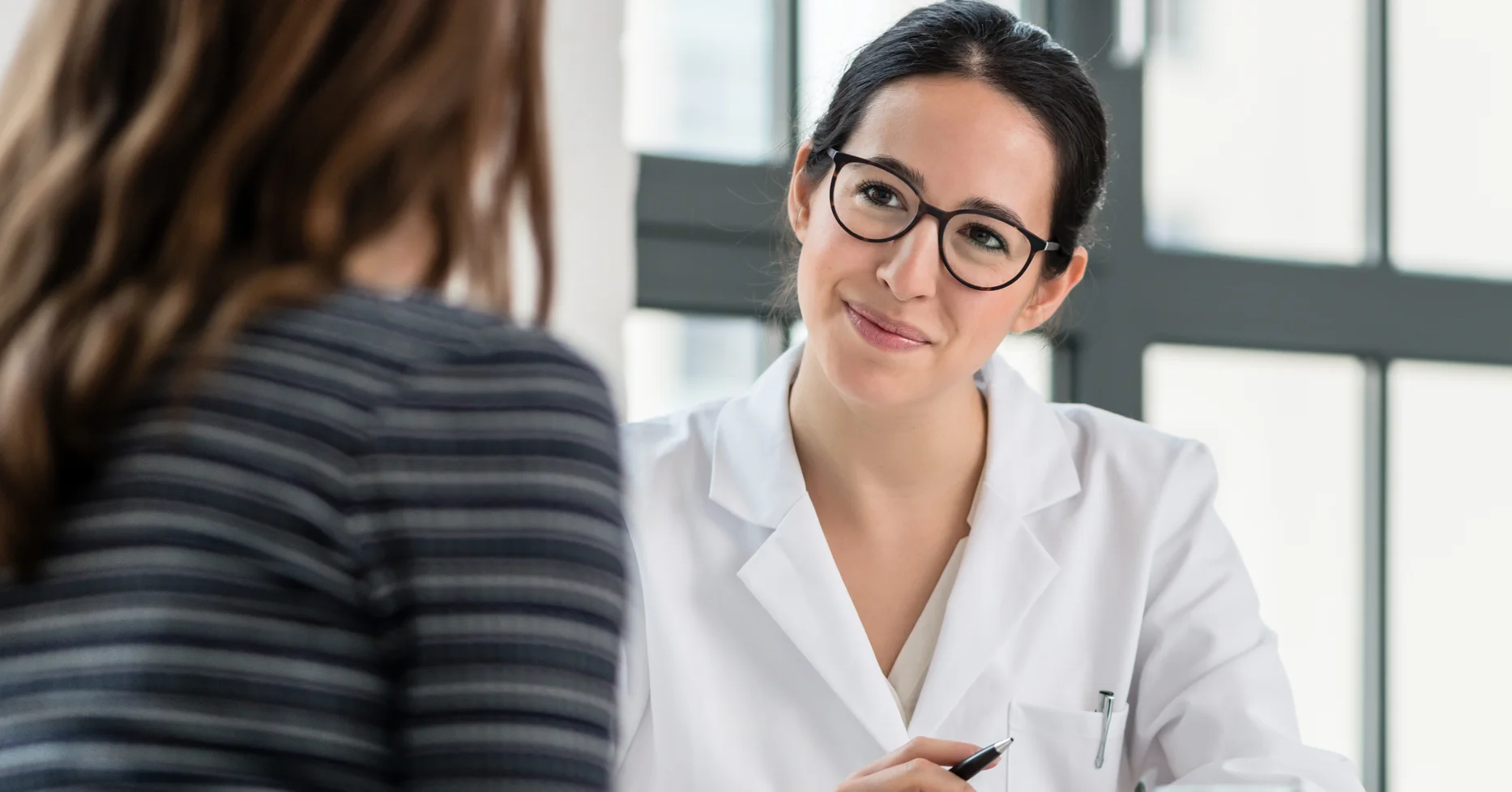 Hospitalist listening to patient