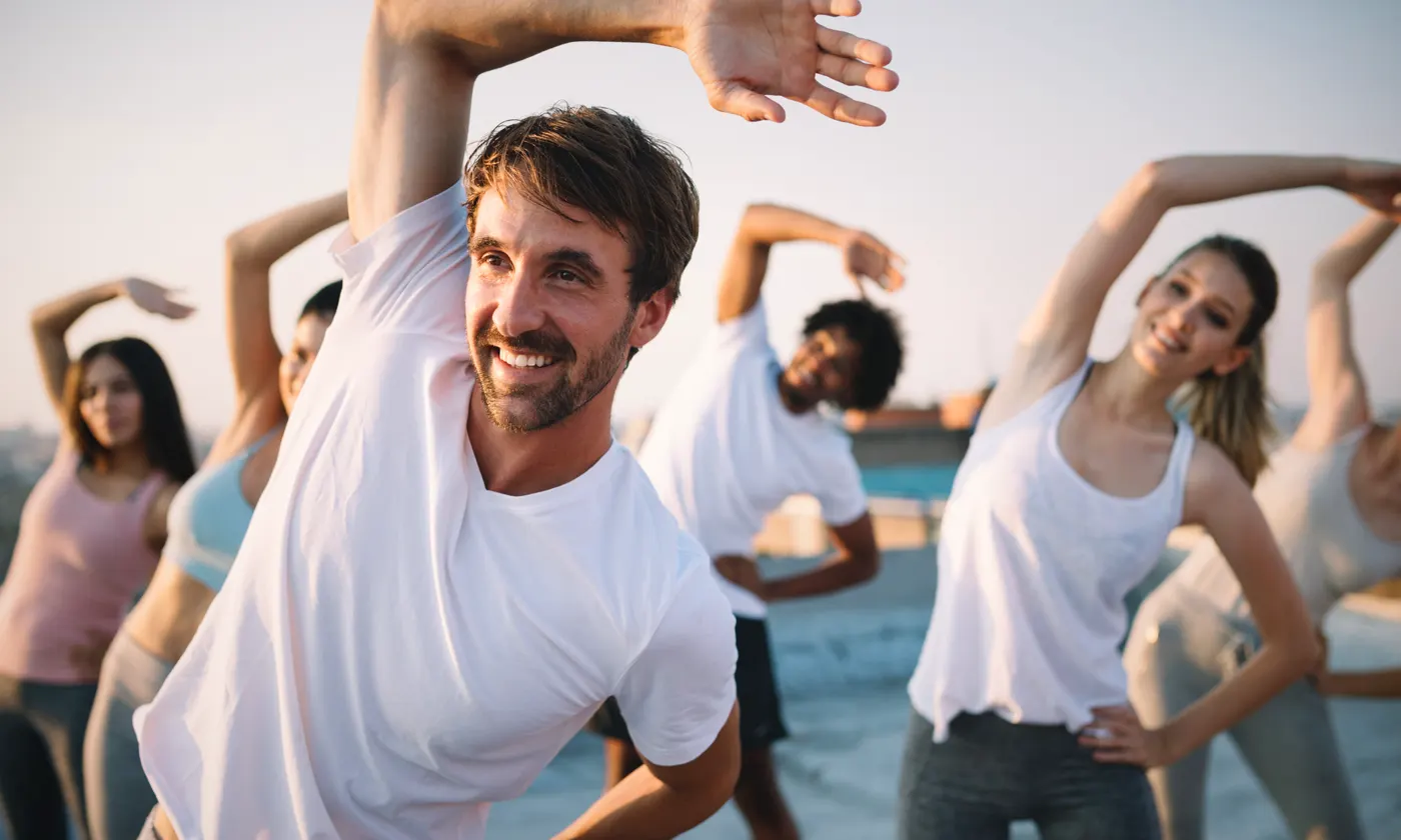 people stretching in exercising class