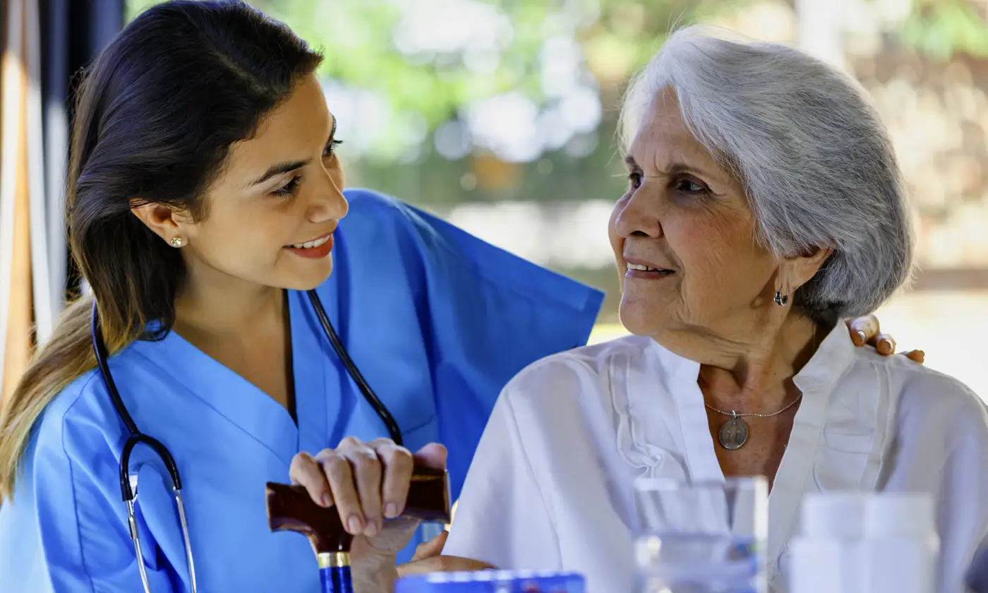 Nurse talking with patient outside