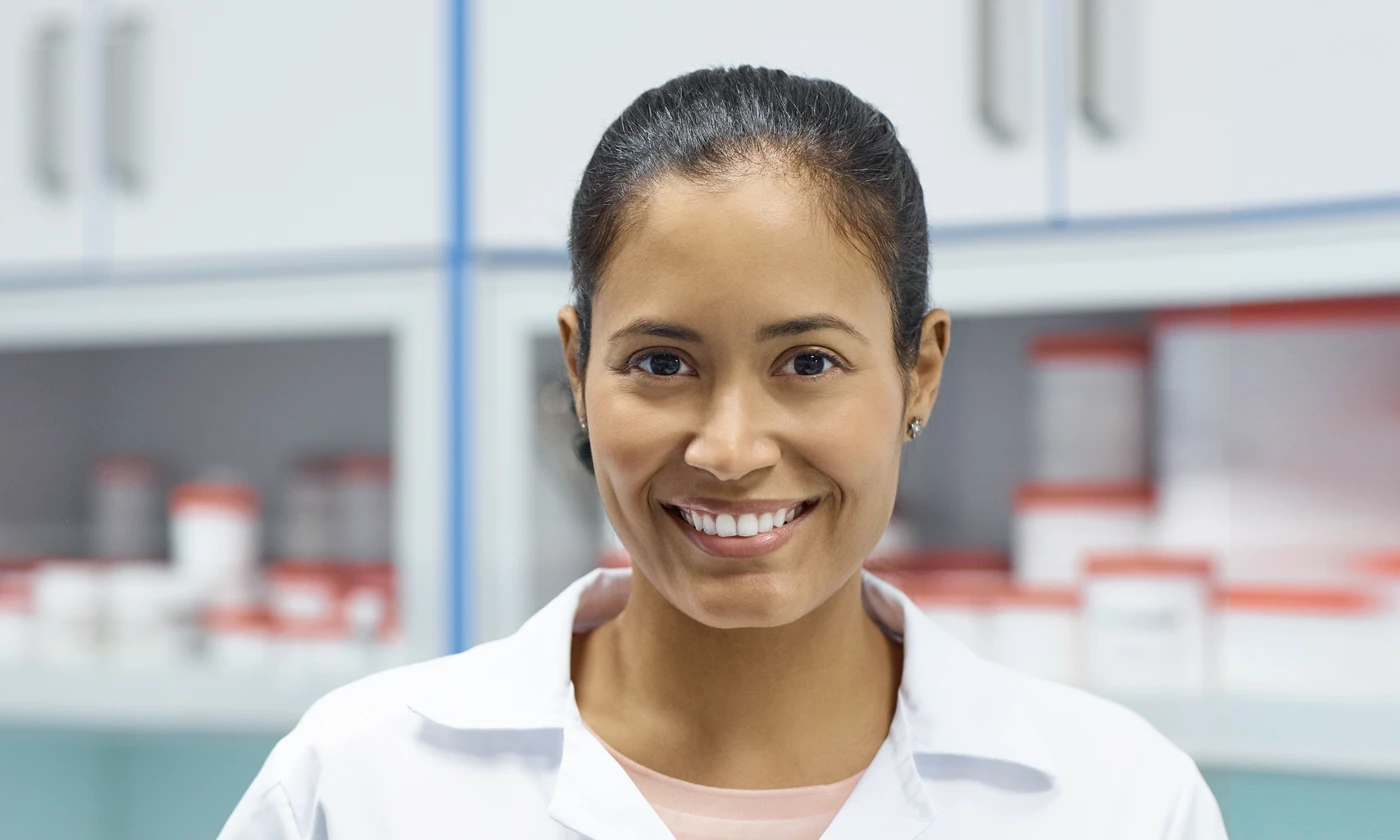 Smiling pharmacist in laboratory